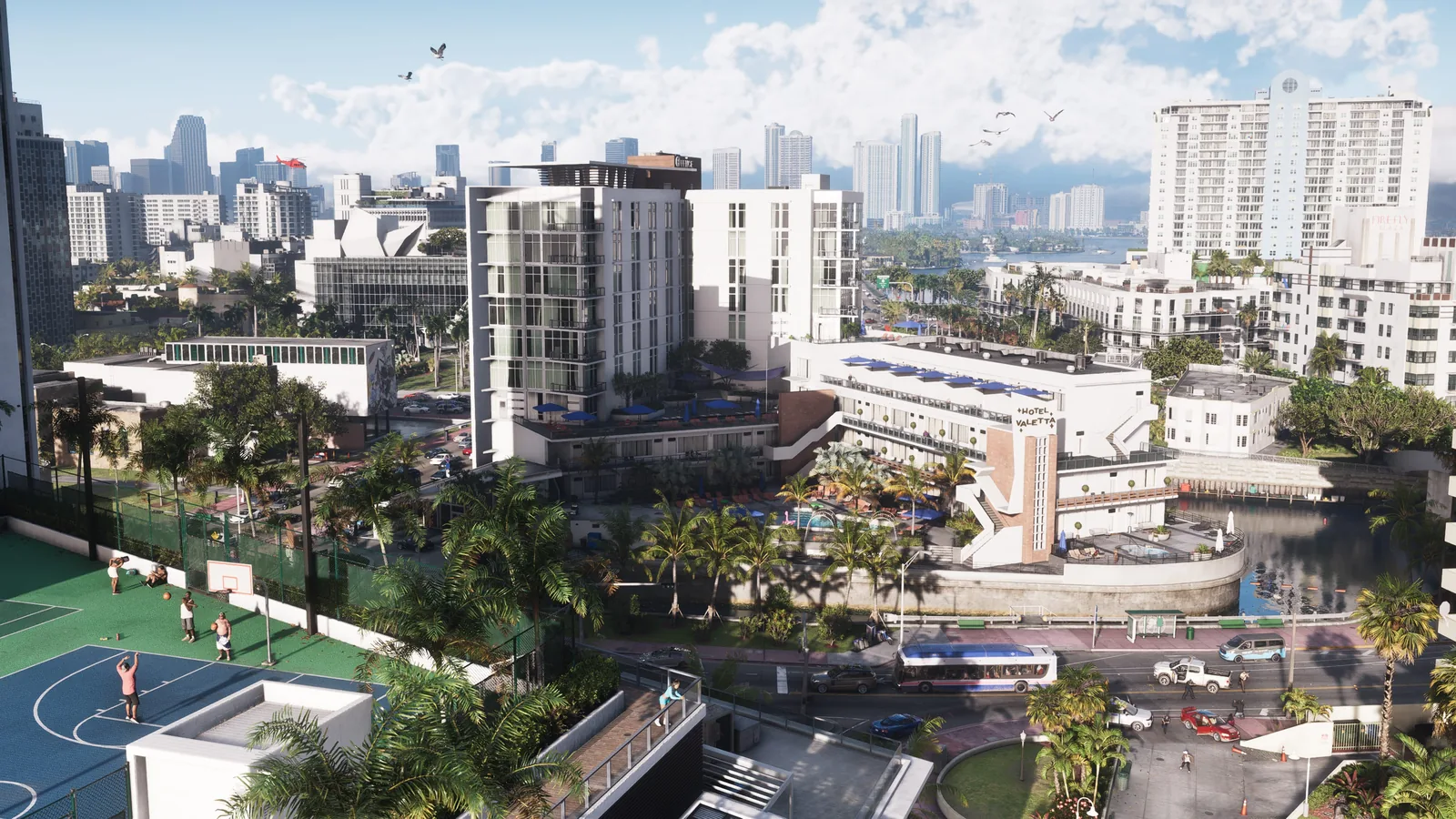 Screenshot officiel de Grand Theft Auto VI, Vice City en plein jour avec l’hôtel Valetta et un terrain de basket