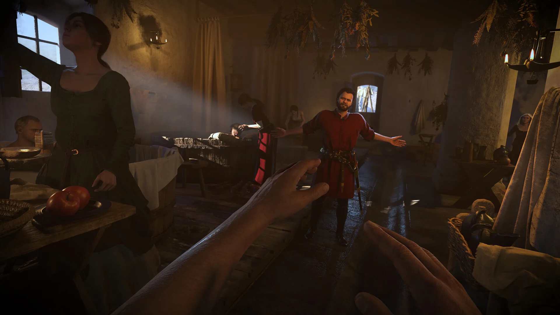 Kingdom Come Deliverance 2 astuces : intérieur d'une auberge éclairée à la bougie