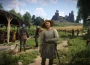 Kingdom Come Deliverance 2 astuces : Henry dans un village de Bohême au pied d'un château